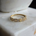 Anillo de Oro 18K Tejido Infinito con Circonias