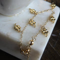 Pulsera de Oro 18K con Dijes de Trébol