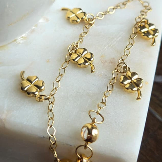 Pulsera de Oro 18K con Dijes de Trébol