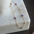 Pulsera de Trébol Morado de Oro 18K