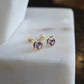 Aretes Redondos con Circonia Morada en Oro de 14K